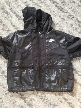 Nike Black Hooded Windbreaker -Style Jacket with Shiny Panels